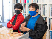 カヌー競技の全国優勝常連校「武庫川女子大学」の木造新築部室棟。船底の曲線を模した屋根に、リベットルーフ防水システムが採用。